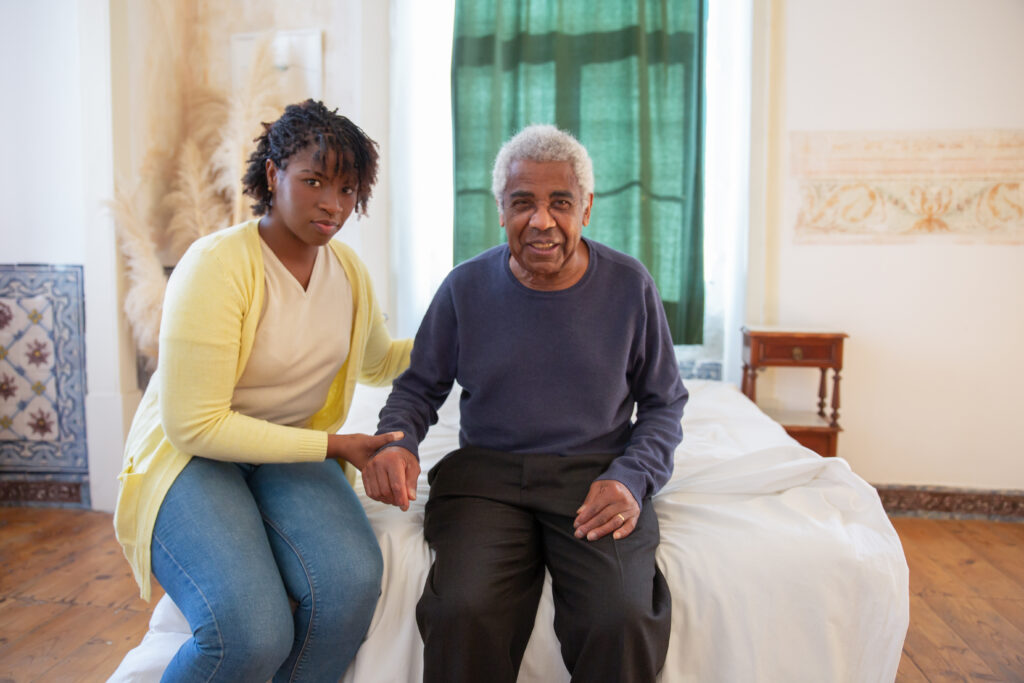 7551671-7551671 Woman and Elderly Man Sitting on Bed